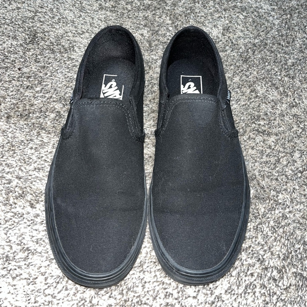 All black slip on VANS